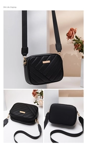 Detailed views of black quilted camera bag with V-shaped stitching and wide fabric strap