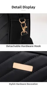 Detailed close-up of quilted V-pattern leather and detachable gold hardware hook