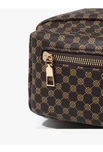Macro detail of brown floral patterned leather bag featuring high-quality gold zipper hardware