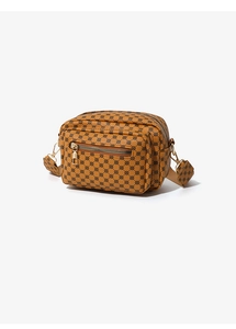 Detail of a brown crossbody camera bag with geometric chain print and gold zippers