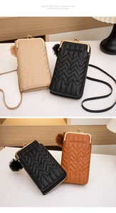 Detail of vertical crossbody phone bag with wave quilting and metal clasp closure