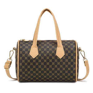 Brown Boston bag with yellow floral pattern, gold hardware and detachable strap