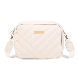 Chic quilted cream crossbody camera bag with elegant gold hardware and wide woven strap