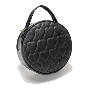 Chic black round handbag with heart quilting and golden hardware for women