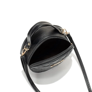 Black round quilted handbag with heart embroidery and gold zipper in luxury style