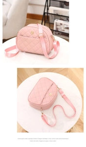 Detail of pink quilted shell bag showing PU leather texture and gold flower hardware