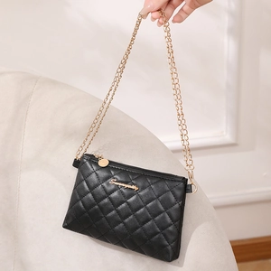 Classic black quilted leather mini shoulder bag with gold chain strap and zipper