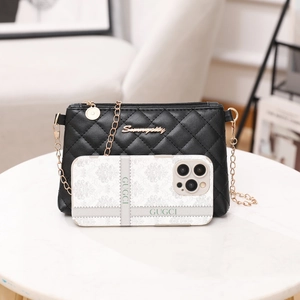 Classic black quilted crossbody phone bag with gold chain strap and metallic logo