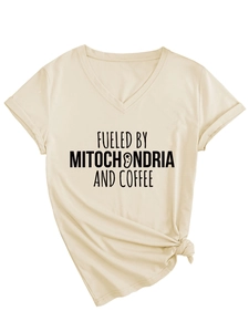 Close-up of beige V-neck T-shirt with Fueled by Mitochondria and Coffee graphic print