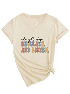 Detail of V-neck beige t-shirt featuring retro alright stop slogan and knotted hem