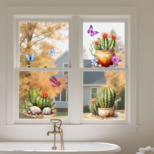 Detailed watercolor window stickers showing cactus plants and butterflies on a white window