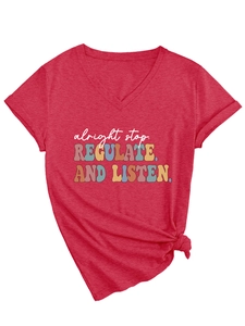 Detail of red V-neck T-shirt with vintage text print and stylish side knot design