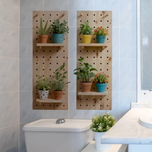 Close-up of wall-mounted wooden pegboard with shelves and miniature potted plants