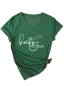 Detail of V-neck dark green t-shirt featuring Be Happy slogan and side knot hem detail