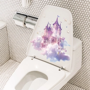 Luminous pink castle wall decal on white toilet lid with purple clouds and stars
