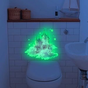 Luminous green castle wall sticker with stars glowing in dark bathroom setting