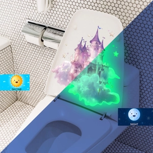 Luminous pink castle toilet sticker with stars showing daytime and green night glow effect