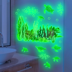 Luminous marine life wall decals featuring sea turtles and seagrass with green glow effect