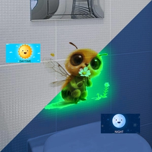 Glow in the dark bee and flower wall sticker showing day and night luminous effect