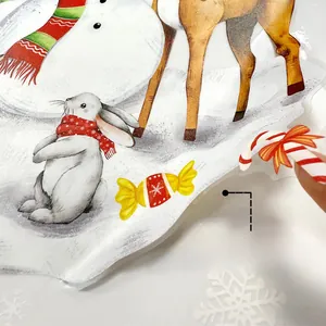 Detail showing double-sided colorful patterns of Christmas window stickers with festive motifs