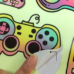 Detail of glow in the dark game controller wall sticker being peeled to show texture