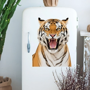 Detailed close-up of a realistic tiger head sticker on a white refrigerator surface