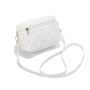 White quilted faux leather crossbody bag with golden hardware and front zipper pocket