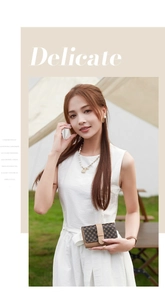 Outdoor model holding a compact wallet with diamond pattern and gold buckle detail