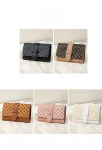 Detail showing various colors of accordion style wallets with geometric print patterns