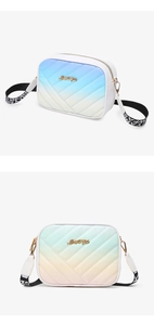 Detail of trendy gradient crossbody bag with golden Lucky For You metal logo and strap