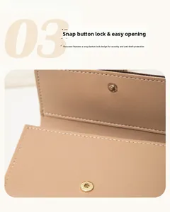 Detailed macro view of litchi grain leather wallet with snap button and white stitching