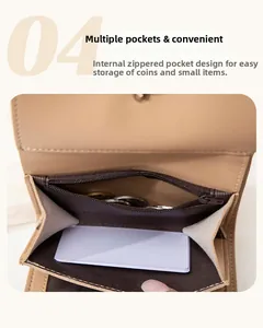 Detail view of the multi-pocket interior with zipper pouch and card slots in a beige wallet