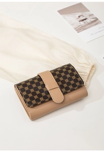 Close-up of a tri-fold wallet featuring brown clover patterns and khaki leather buckle