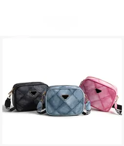 Detailed comparison of quilted denim cross-body bags with logo plate and woven shoulder straps