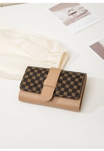 Detail of compact bi-fold wallet featuring vintage clover pattern and lychee grain texture