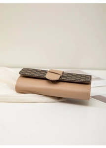 Detail of contrast stitch and brown floral pattern flap on the long women wallet