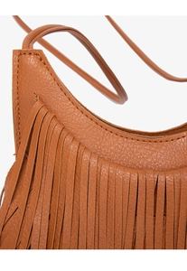Close-up of caramel leather bag featuring tiered tassel fringe and pebbled texture details
