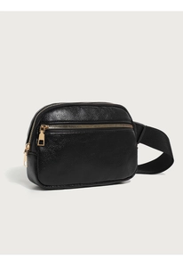 Detail of black pebbled leather waist bag with premium gold zipper and wide strap