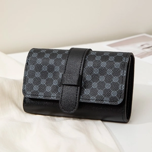 Short black bifold wallet for women with clover pattern flap and belt buckle closure