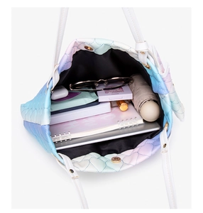 Spacious interior of gradient quilted tote bag showing daily essentials and storage