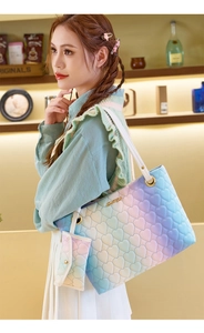 Close-up of macaron gradient tote bag set with heart quilting and matching coin purse