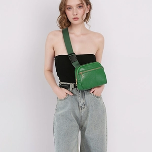 Grass green lychee leather crossbody chest bag with adjustable strap and gold zippers