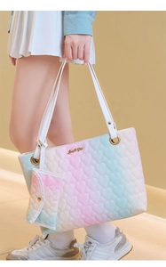 Detail of gradient heart-quilted tote bag featuring gold Love For You metal emblem