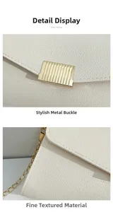 Detail view of cream-colored pebble leather texture and gold-tone metal hardware