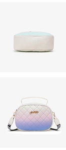 Detail showing the gradient quilted leather texture and golden metal logo of the handbag