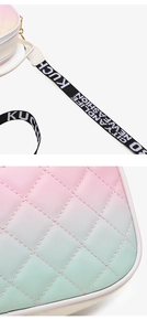 Detail of gradient quilted crossbody bag with embroidered lettered nylon shoulder strap