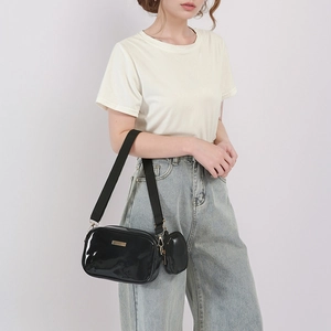 Glossy black PU leather crossbody bag with wide strap and mini coin purse attachment
