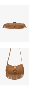 Detail view of brown suede shoulder bag with long tassel fringe and silver metal buckle