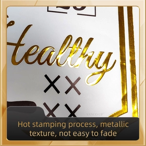 Macro shot of gold hot stamping Healthy lettering on white textured wall sticker