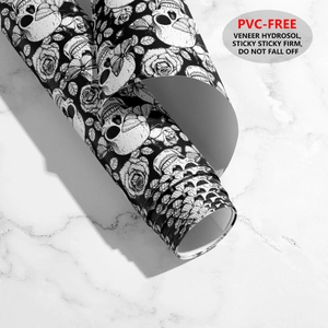 Detail of PVC-free skull and rose wallpaper showing strong adhesive and texture